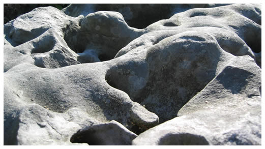 Naturally shaped stone surfaces with hollows and varied textures
