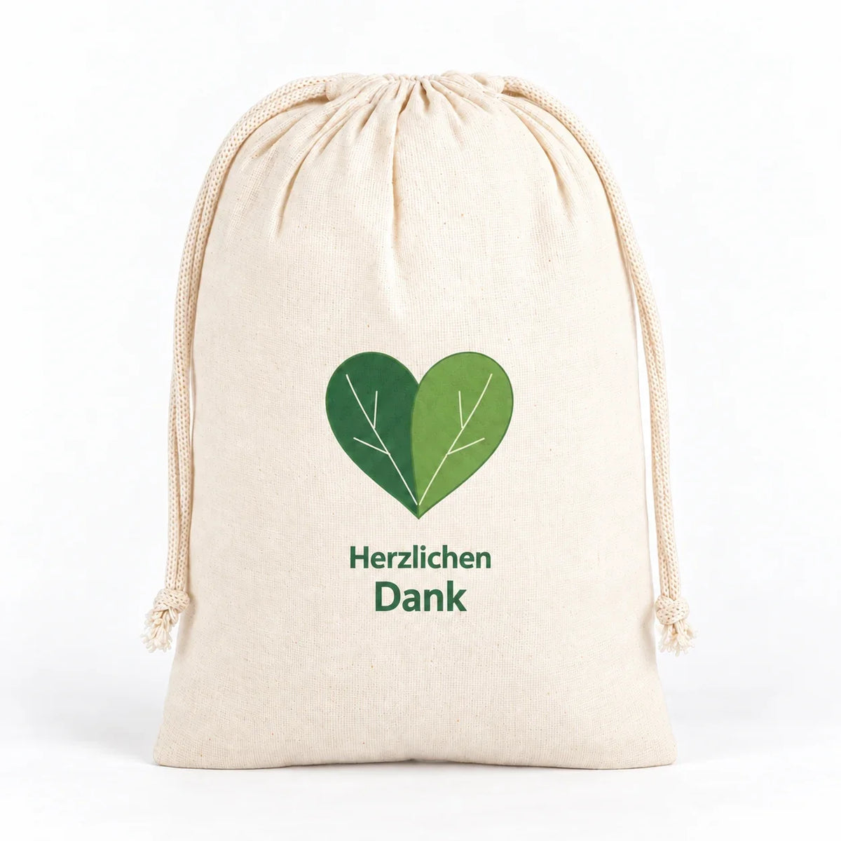Naturfarbener Kordelzugbeutel mit grünem Blätterherz und dem Schriftzug „Herzlichen Dank“.